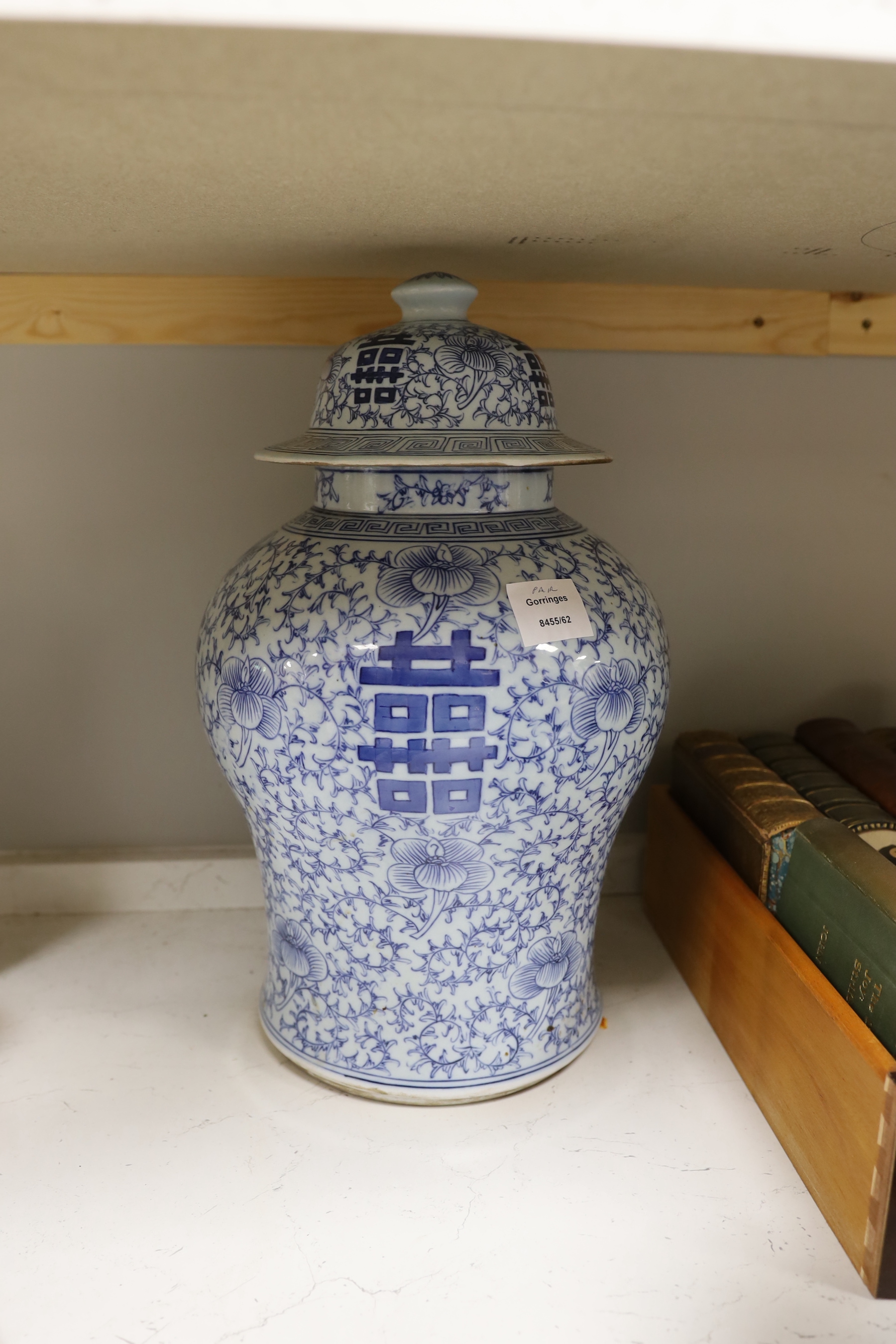 A pair of 19th/20th century Chinese blue and white ‘shuangxi’ baluster lidded vases, 43cm